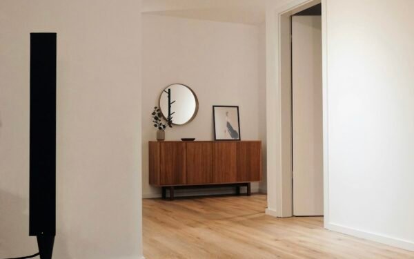 Polished natural oak hardwood flooring with clean modern trim