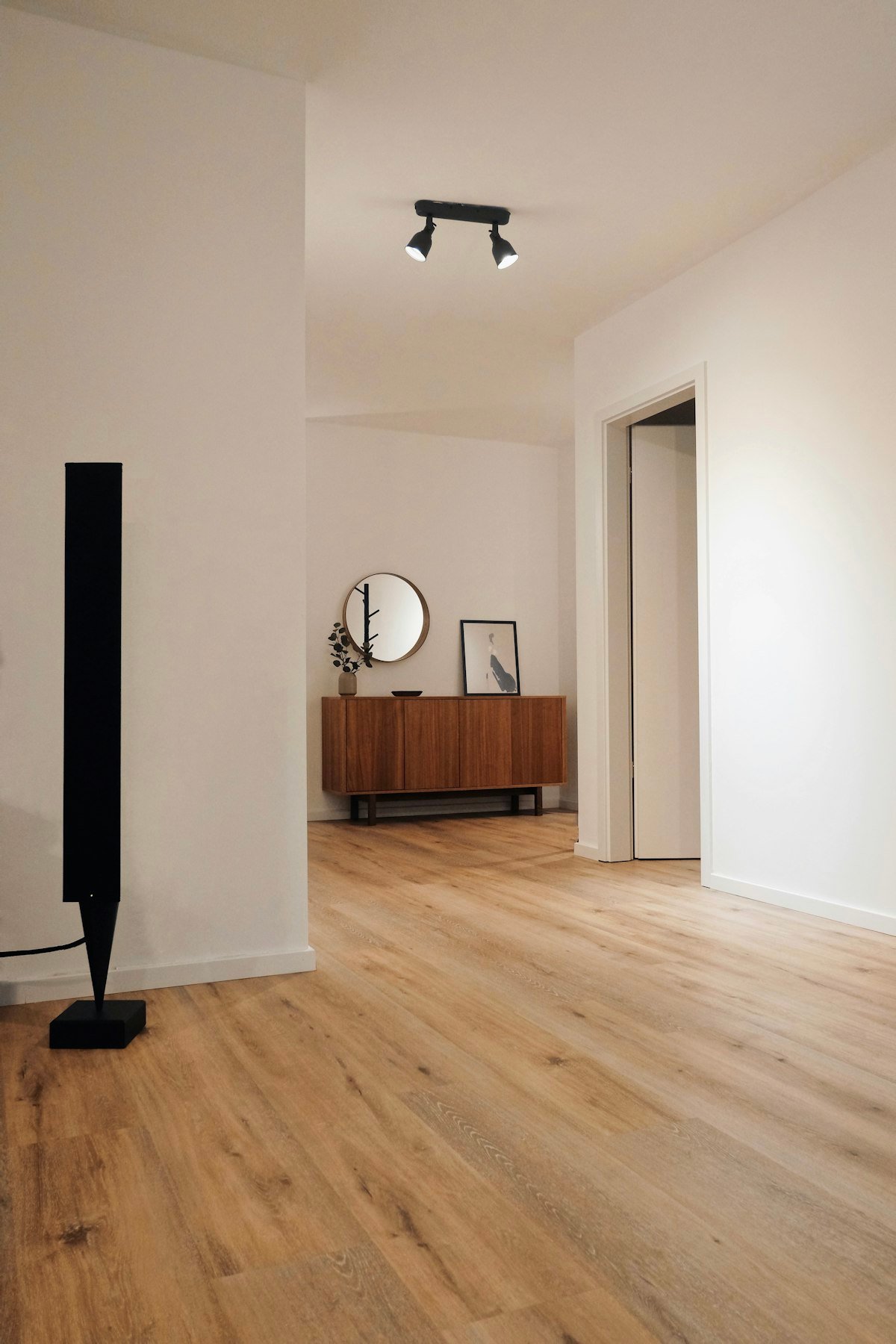 Polished natural oak hardwood flooring with clean modern trim