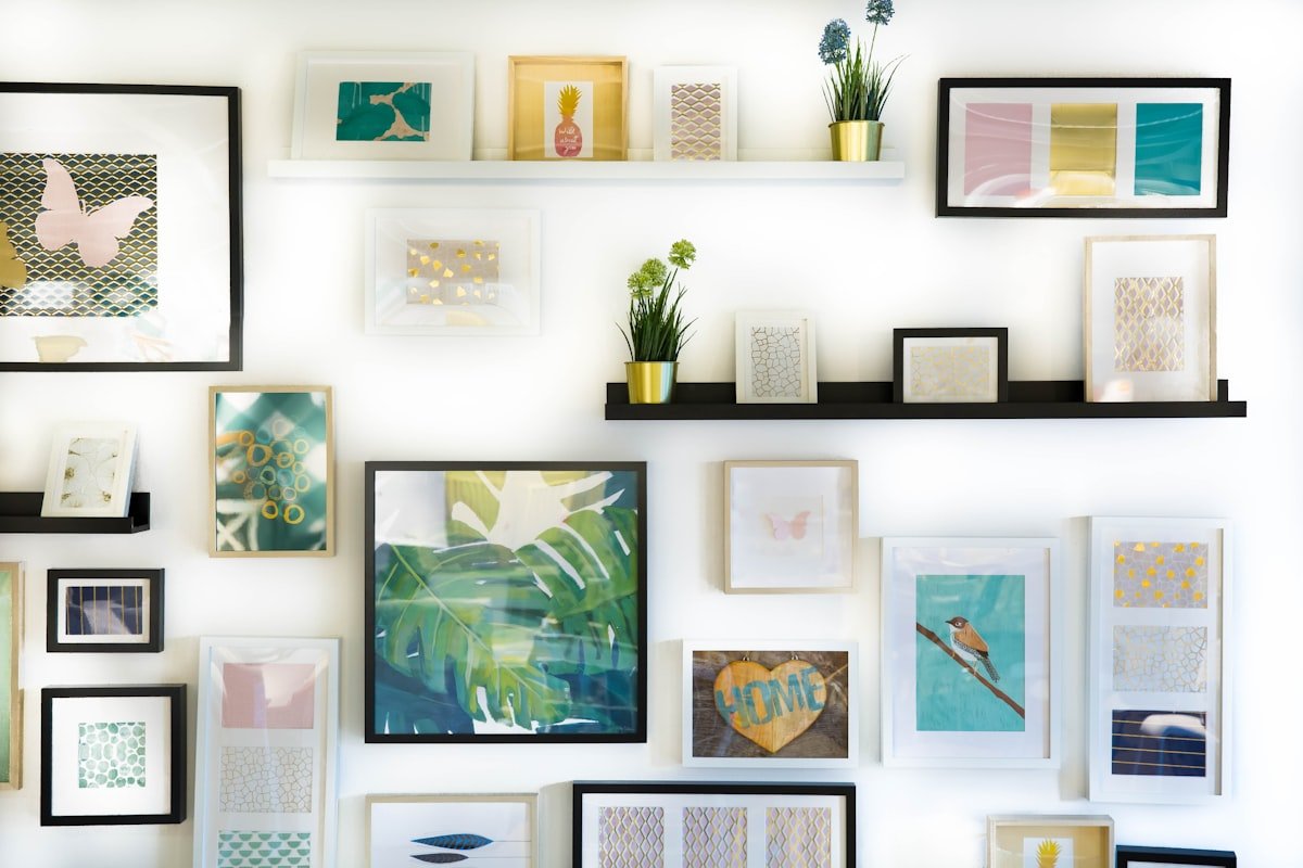 Stylish entryway with round mirror, wooden console table, and coat hooks