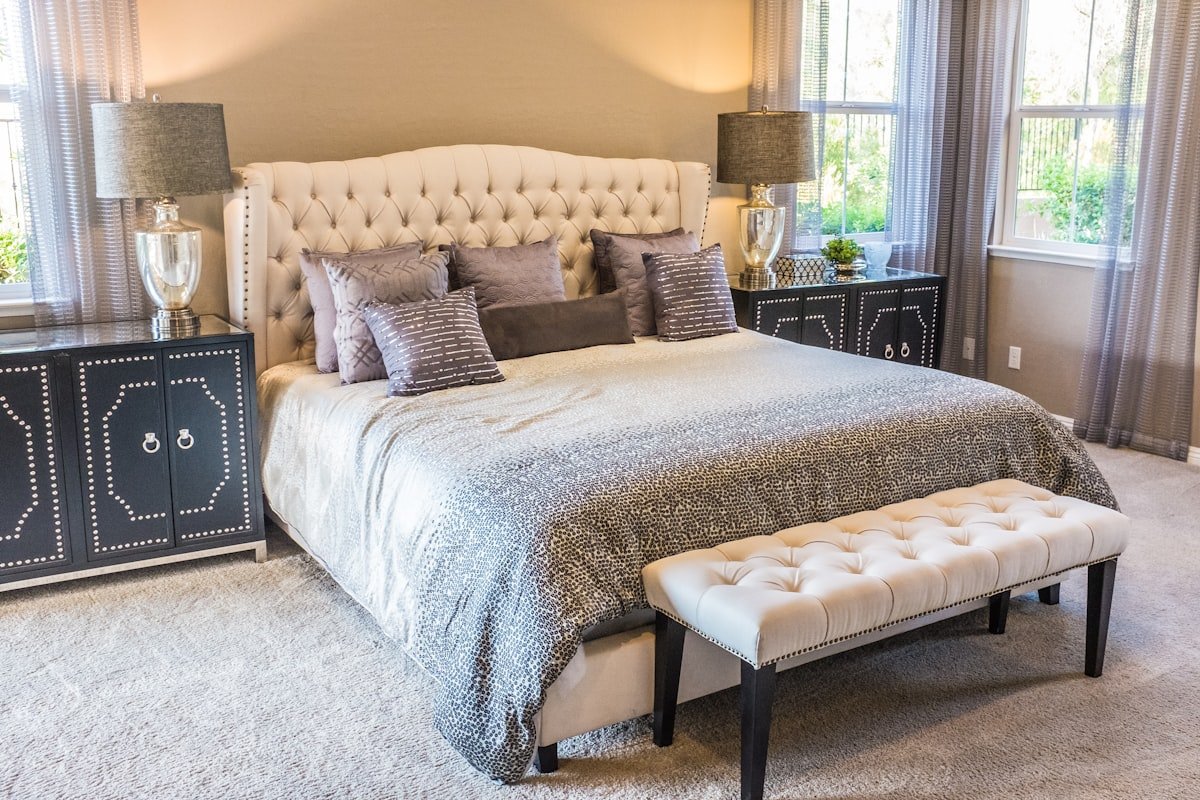 Serene minimalist bedroom with natural linen duvet and soft ambient lighting