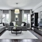 Living room with large textured wool area rug grounding sofa and coffee table