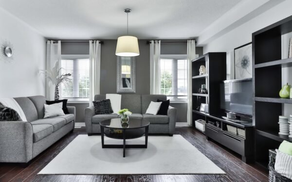 Living room with large textured wool area rug grounding sofa and coffee table