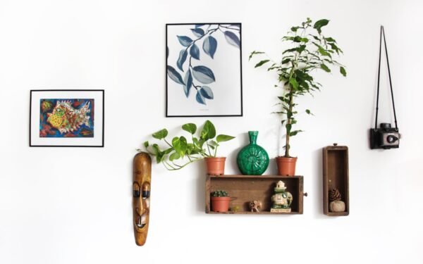 Curated coffee table with ceramic vase, art books, and textured neutral tray