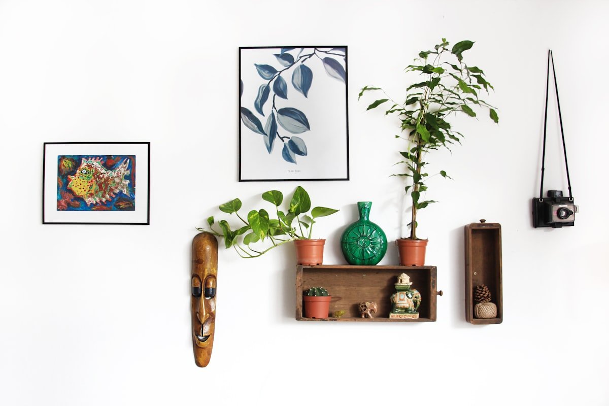 Curated coffee table with ceramic vase, art books, and textured neutral tray